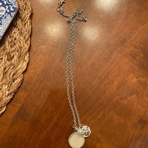 Paper Store silver necklace with 3 charms.